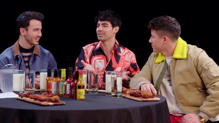 The Jonas Brothers Burn Up While Eating Spicy Wings