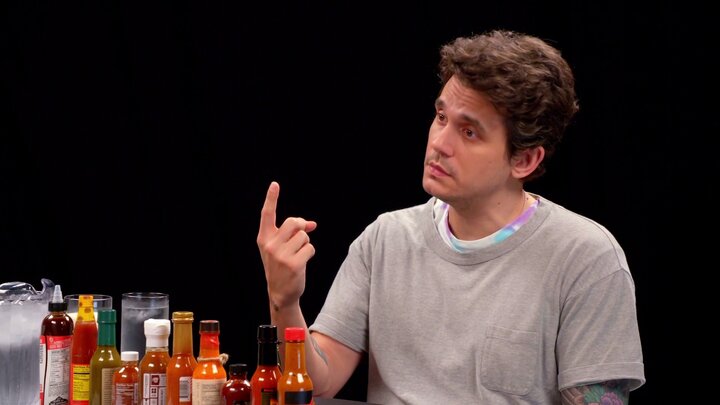 John Mayer Has a Sing-Off While Eating Spicy Wings